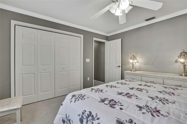 3943 W Fieldwood Ct, Lecanto, FL 34461 - bedroom with light colored carpet, a closet, ornamental molding, and ceiling fan