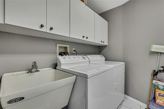 3943 W Fieldwood Ct, Lecanto, FL 34461 - laundry area featuring washer and dryer, cabinet space, and baseboards