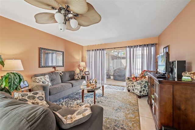 living area featuring light tile patterned flooring and a ceiling fan