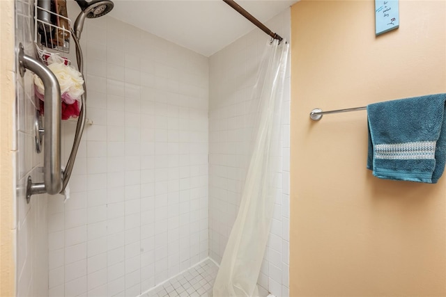 full bath with a tile shower