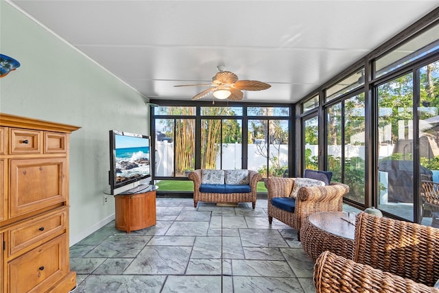 sunroom featuring a ceiling fan