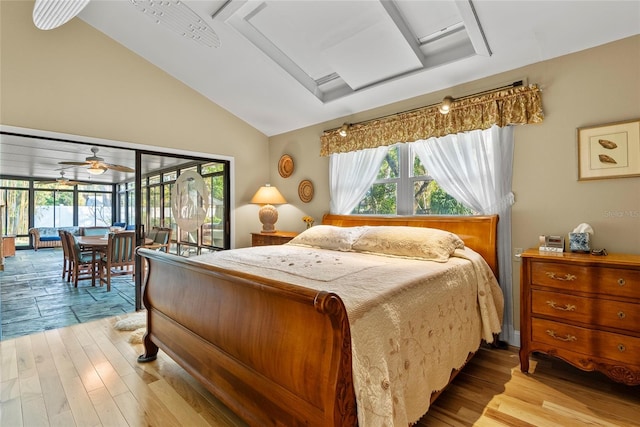 bedroom with access to exterior, multiple windows, and light wood finished floors