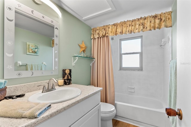 bathroom featuring toilet, vanity, shower / tub combo, and wood finished floors