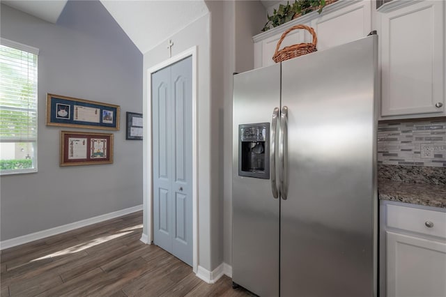 kitchen with white cabinetry, tasteful backsplash, stainless steel fridge, and dark wood-style flooring