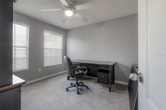 home office with baseboards, carpet, and ceiling fan