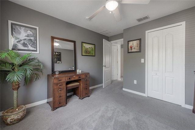 bedroom featuring visible vents, baseboards, and light colored carpet