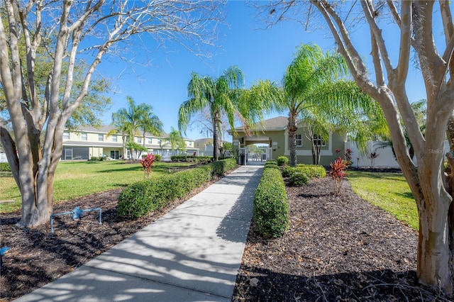 view of property's community featuring a yard