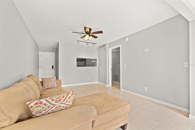 living room with rail lighting, visible vents, light tile patterned flooring, and a ceiling fan