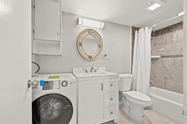 full bath featuring tile patterned floors, toilet, washer / clothes dryer, shower / bath combination with curtain, and vanity