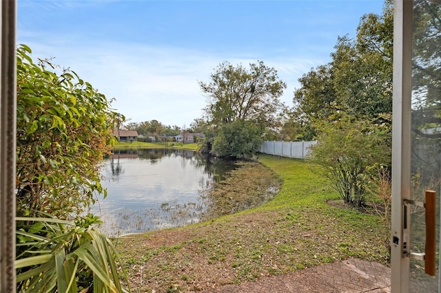 property view of water featuring fence