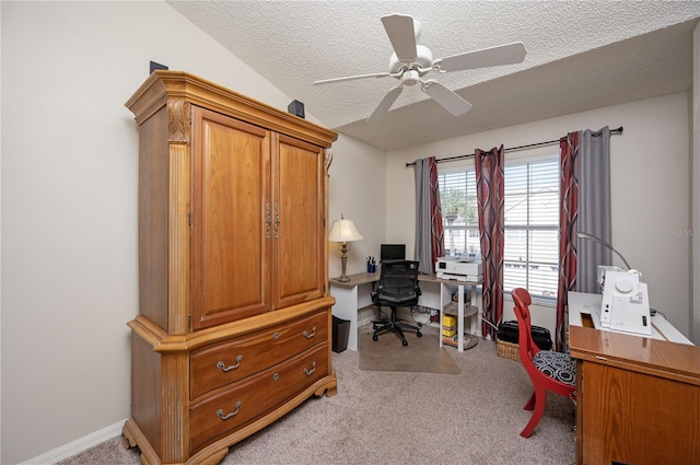 office area with baseboards, light carpet, a textured ceiling, and a ceiling fan