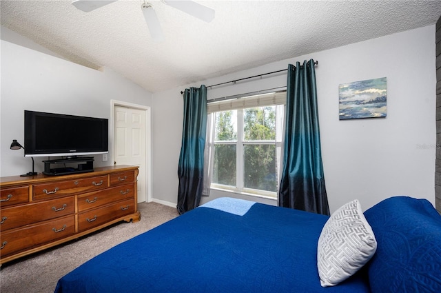 bedroom with baseboards, lofted ceiling, carpet floors, a textured ceiling, and a ceiling fan