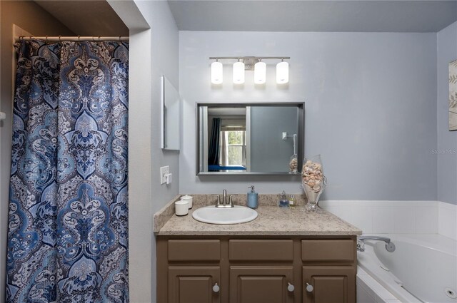 full bath with a shower with curtain, a garden tub, and vanity