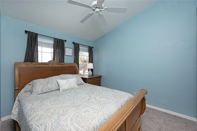 carpeted bedroom featuring ceiling fan, a textured ceiling, baseboards, and vaulted ceiling