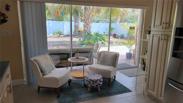 living area with light tile patterned floors