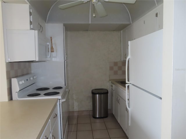 kitchen featuring white cabinetry, white appliances, light countertops, and decorative backsplash