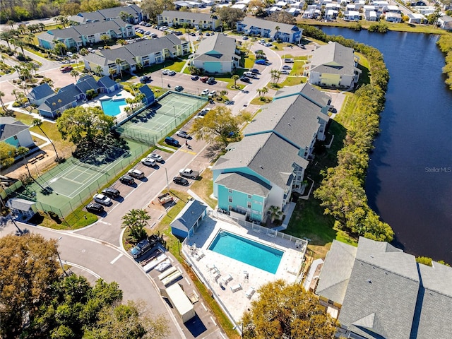 birds eye view of property featuring a residential view and a water view