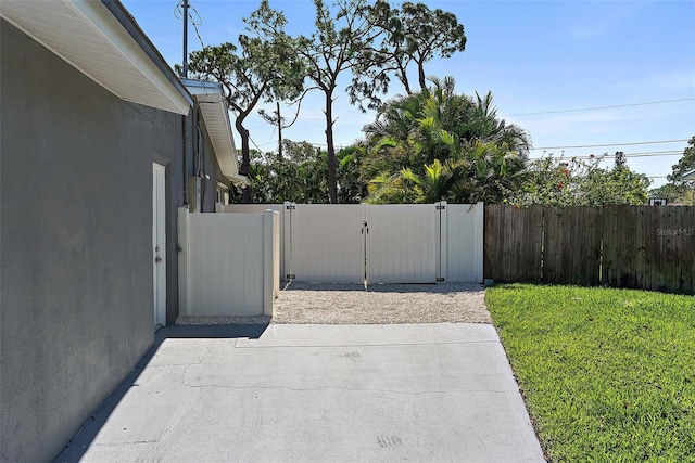 exterior space featuring fence and a gate