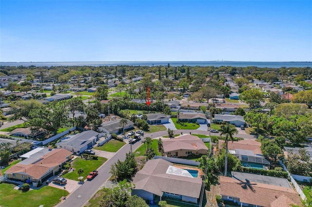 bird's eye view featuring a residential view and a water view