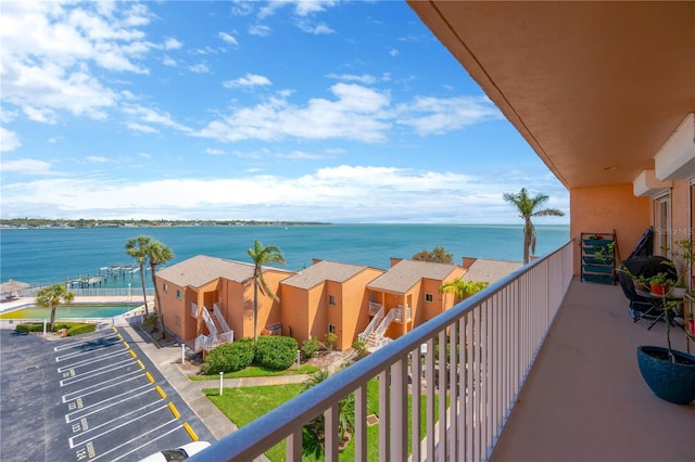 balcony featuring a water view