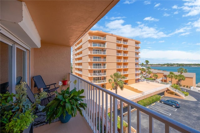 balcony featuring a water view