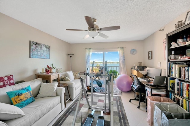 office featuring a textured ceiling and a ceiling fan