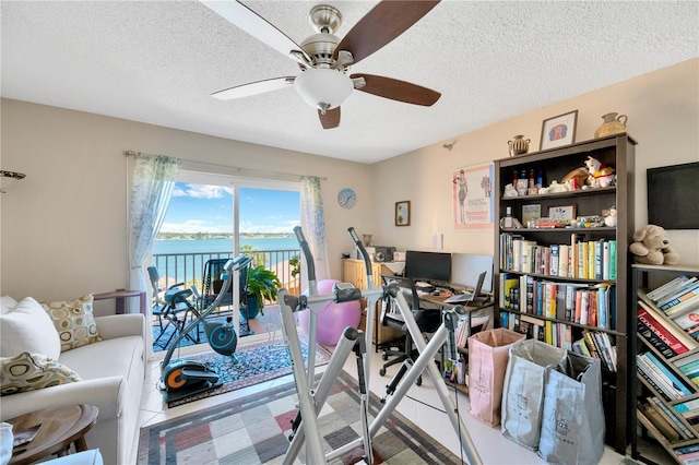 office space featuring a textured ceiling and ceiling fan