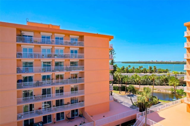 view of building exterior with a water view