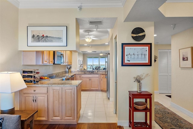 bar featuring visible vents, light tile patterned flooring, a sink, crown molding, and stainless steel microwave