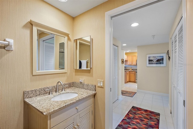 bathroom featuring recessed lighting, a closet, tile patterned flooring, baseboards, and vanity