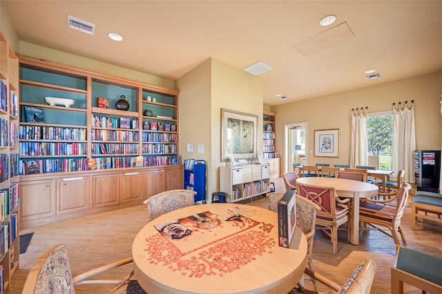 dining room with recessed lighting, visible vents, and wood finished floors