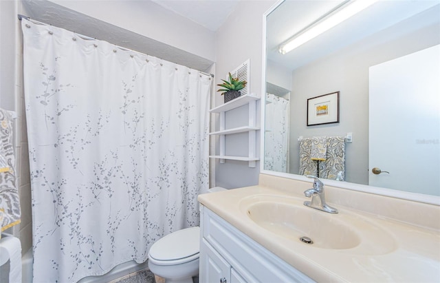 full bathroom featuring toilet and vanity