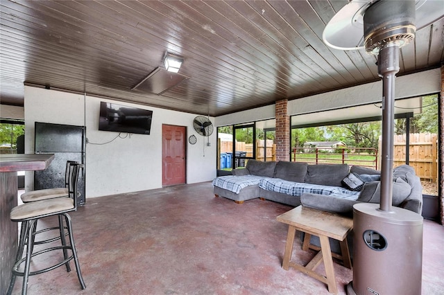 sunroom featuring wood ceiling