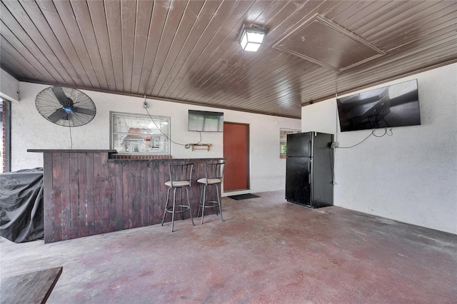 interior space with outdoor wet bar and area for grilling