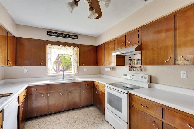 kitchen with under cabinet range hood, a sink, white appliances, light countertops, and ceiling fan