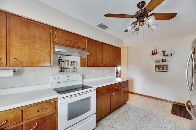 kitchen with visible vents, under cabinet range hood, light countertops, brown cabinets, and white electric range oven