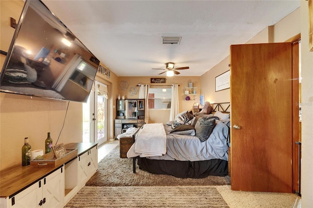 bedroom featuring visible vents and a ceiling fan