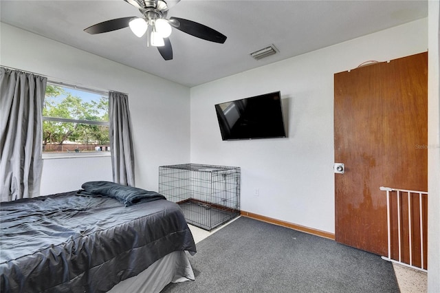 bedroom with visible vents, carpet flooring, baseboards, and ceiling fan