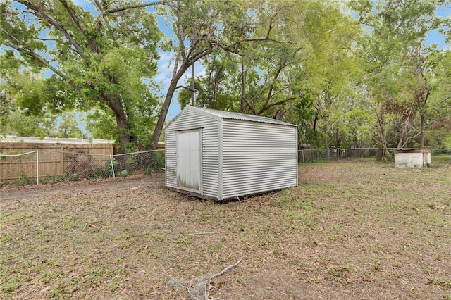 view of shed with a fenced backyard