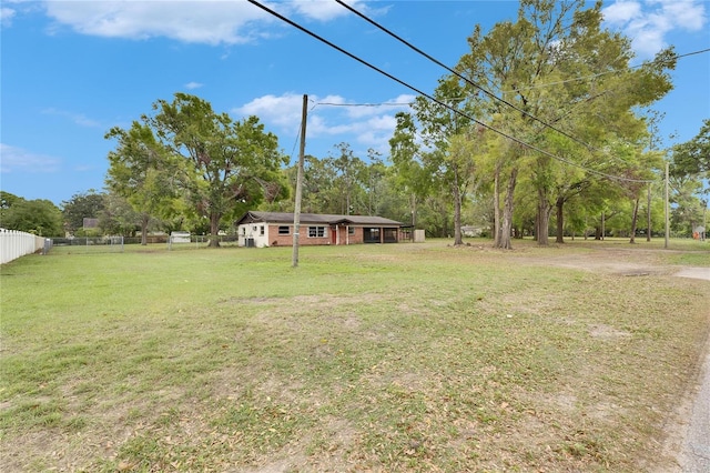 view of yard featuring fence