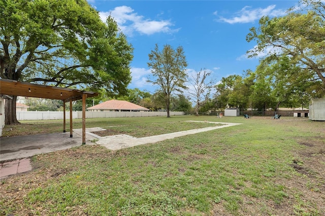 view of yard featuring a patio and a fenced backyard