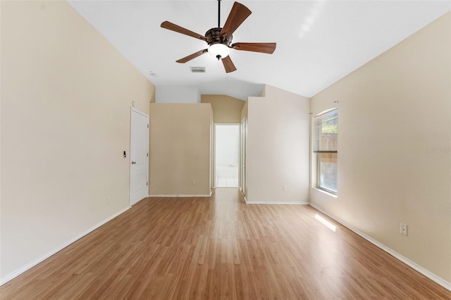 unfurnished room with visible vents, baseboards, ceiling fan, light wood-type flooring, and lofted ceiling