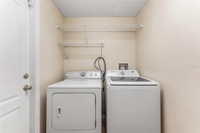 laundry room featuring laundry area and washing machine and dryer