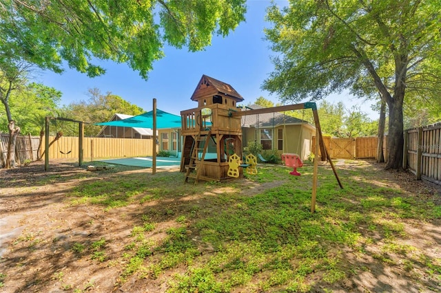 view of play area with a fenced backyard