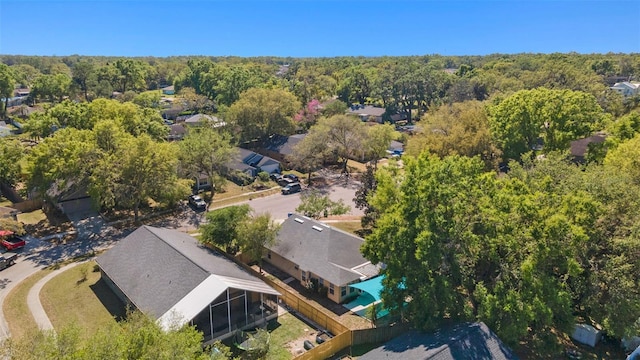 drone / aerial view featuring a view of trees