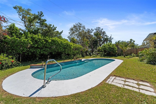 view of pool with a yard, fence, and a fenced in pool