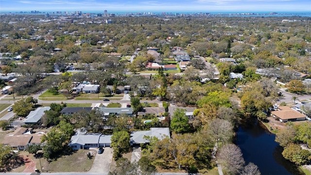 drone / aerial view with a residential view and a water view