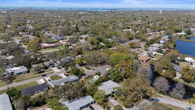 drone / aerial view with a water view and a residential view