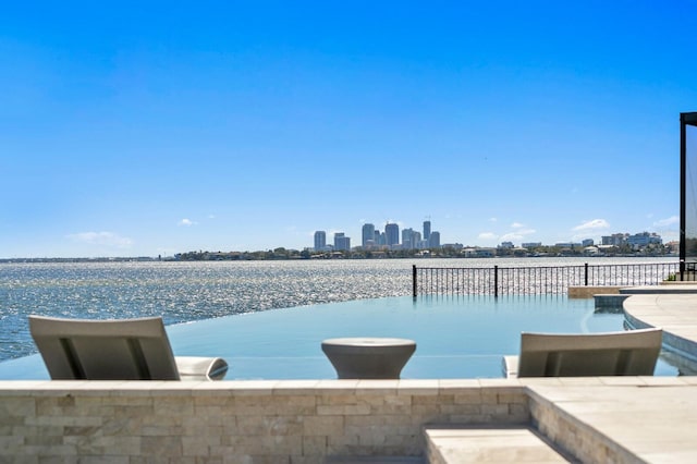 view of swimming pool with a city view