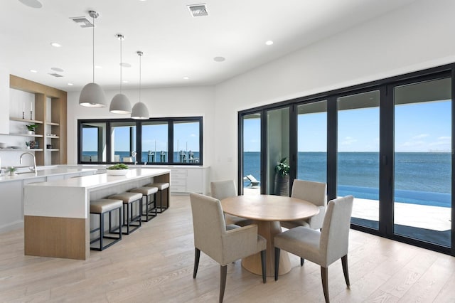 dining space with visible vents, recessed lighting, and light wood-style floors